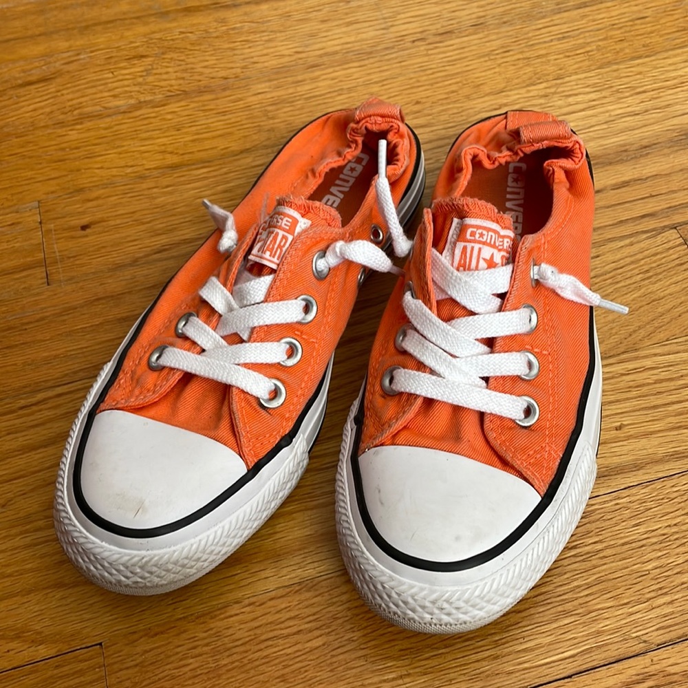 Orange slip on low top Converse